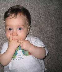 Jacob at 6 months with his hand in his mouth